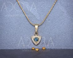 "✿ DESCRIPTION Solid 14K gold necklace set with Light Blue Sapphire and natural diamonds. An intriguing gold necklace set with a center square light blue sapphire and surrounded by brilliant tiny diamonds. This unique triangle shape pendant is delicate but has its own glitter and light. THE PENDANT Made of 14k solid gold, and set with 0.20ct/3mm, square Light Blue Sapphire. The center stone is surrounded by 17 tiny diamonds along the triangle curves. Diamonds clarity is SI and color G-H. Total g Sapphire Pendant Necklace, Light Blue Sapphire, Blue Sapphire Pendant, Sapphire Necklace Pendants, Diamonds Necklace, Gold Diamond Necklace, Gold Necklace Set, Personalized Pendant, Tiny Diamond