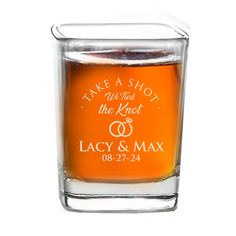 an orange shot glass with the words take a shot and the knot is in it