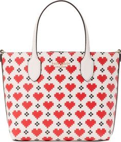 a red and white handbag with hearts on it