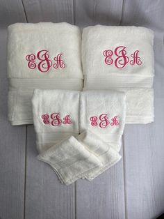 three towels with monogrammed letters on them and one towel has the letter b