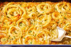 a casserole dish with onion rings and cheese on top, ready to be eaten