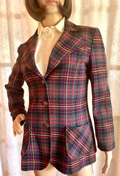 Vintage 1970s Mr B Wool Women's Blazer Jacket, Excellent Condition, Size S This beautiful wool blazer features a wide peak collar with brass buttons and applied pockets. The tag reads "Size 8", but the blazer fits the size "Small" manikin perfectly!  Condition: Excellent, vintage wool blazer is fully-lined and features vivid plaid wool fabric, intact stitching, and original brass buttons. An excellent, vintage piece! Fitted Plaid Wool Sport Coat, Plaid Wool Sport Coat, Winter Fitted Plaid Sport Coat, Winter Plaid Fitted Sport Coat, Vintage Single-breasted Wool Blazer, Vintage Fitted Plaid Outerwear, Fitted Vintage Plaid Outerwear, Vintage Outerwear With Welt Pockets For Office, Vintage Plaid Blazer With Notch Lapel