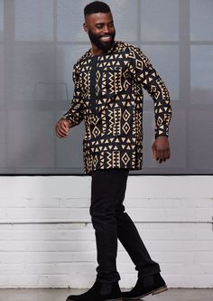 Style#M2076TBT The Ibrahim in Tan Black Tribal is sure to turn heads this season. Stay comfortable and stylish by pairing with your favorite pair of jeans. Shop the matching items here. *The shirt you receive may vary slightly from the product image. It is the same fabric but may be cut in a different section of the print* Description All-Over-Print Traditional Top Hidden Button-Up at Placket 2 Vents at the Sides 100% Cotton Body ​97% Cotton/3% Lycra Placket and Welt Pocket Designed in the USA, African Male Outfits, Traditional Shirts For Men African, African Print Shirts For Men, Ankara Shirts For Men, Men African Fashion, Palazzo Pants Outfit, African Print Shirt, African Shirts For Men, Dresses African