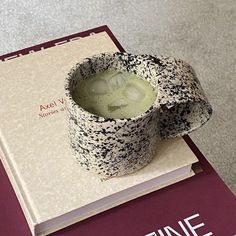 a book with a cup on top of it