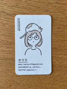 a business card with a drawing of a woman wearing a santa hat on it's head