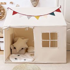 a cardboard doll house with the door open