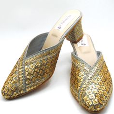 Check out our new collection of designer wedding shoes which we offer for you. These beautiful shoes are gray with gold sequins work on embroidered all around the shoe and round front shaped. These are extremely comfortable wedding shoes with a low heel these are comfortable to wear for long hours. These are perfect for your wedding or a formal event. These bridal shoes offer a heel size of 3 Inches. Don't miss out on these beauties! See our page for more of our collection! We ship out in a timely matter, wrapped in care for a safe secure trip to your location. Thank you for supporting our small business! Shipped from USA. Sizes available US 6,7,8,9,10. Gold Slip-on Heels For Wedding, Gold Wedding Shoes For Spring Wedding Guest, Gold Wedding Guest Shoes For Spring, Festive Wedding Shoes With Round Toe For Party, Gold Heels For Spring Wedding Guest, Gold Heels For Wedding Guest In Spring, Elegant Festive Heels For Evening, Elegant Festive Heels For Party, Elegant Evening Heels For Festive Occasions