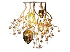 a chandelier made out of branches and lights hanging from it's sides