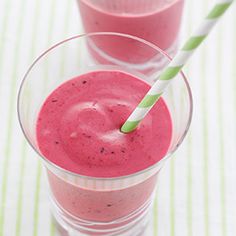 two glasses filled with pink smoothie next to each other