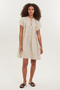 Introducing our Lulu Tunic Dress, crafted from fine European linen. Our Lulu features a flattering v-neckline and pleated bodice details, making it both feminine and practical. Perfect for a throw-on-and-go look! Lightweight linen, 100% Euro Linen Pleated detailing along the neck, soft v-neckline Cap-sleeves style, relaxed A-line fit Machine Wash, Hang to Dry or Tumble Dry Low for our relaxed look Available in sizes S-XL and various colors Studio Model in White is 5'9" and is wearing a Small Loc Neutral Linen Dress With Relaxed Fit, Summer Linen Dress With Pleated Waist, Neutral Linen Day Dresses, Neutral Linen Dresses For Daywear, Neutral Relaxed Fit Linen Dress, Spring Linen Dress With Pleated Waist, Elegant Pleated Linen Dress, Linen Pleated Dress For Daywear, Neutral Relaxed Linen Dress