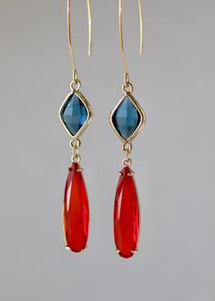 Blue and Red Beautiful, Elegant X-Long earrings with Faceted Blue Rombus Shaped Crystal Glass Connectors 15 x 10 mm. Faceted Bright Red Slim Drops in Gold plated over the brass 32 x 8 mm Gold plated Long Almond Ear Wire 40 x 20 mm. The total length is 3.75 inches or 95 mm long. Your order will be wrapped and shipped in jewelry gift box. * * * * * * * * * * * * * * * * * * * * * * * * * * * * * * * * * * * * * * * * * * Please enter my shop here - www.etsy.com/shop/ZarinaJewelry or my FB page www Red And Blue Jewelry, Long Almond, Asymmetrical Earrings, Wedding Party Gift, Gold Aesthetic, Gift For Daughter, Jewelry Christmas, Red Earrings, Blue Jewelry