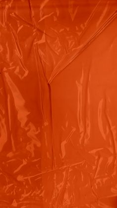 an orange plastic bag is shown in close up view with no image on the bottom