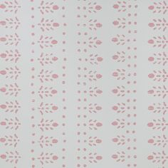 a white and pink wallpaper with small dots on the top right side of it