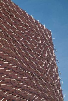 a large brick building that is made to look like it has been constructed into the shape of a triangle