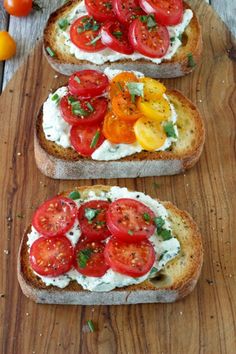 two slices of bread with tomatoes and cream cheese on them