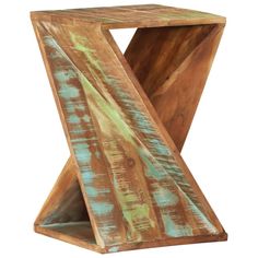 an odd shaped wooden table with blue and green paint