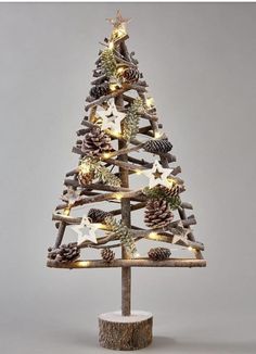 a wooden christmas tree with pine cones and lights