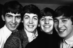 the beatles are posing for a photo together