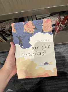 a person is holding up a book in their hand that reads are you listening?