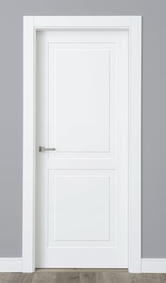 an open white door in a room with gray walls and wood flooring on the side