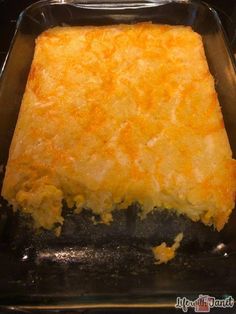 a casserole dish with cheese on top in a glass baking pan, ready to be eaten