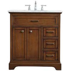 a bathroom vanity with two sinks and drawers