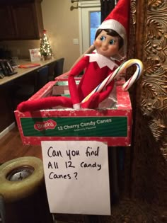 an elf is sitting in a candy cane box with a sign that says, can you find all 12 candy canes?