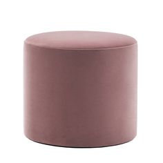 a small round ottoman in pink velvet