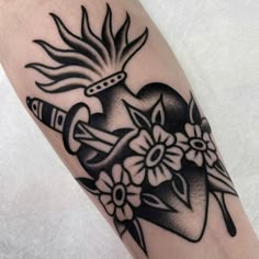 a black and white tattoo design on the arm