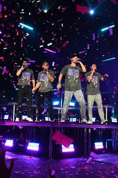 the backs perform on stage with confetti in the air