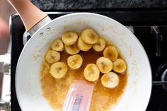 bananas being cooked in a frying pan on the stove