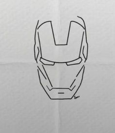 an iron man mask drawn in black ink on white paper with the outline of it's face