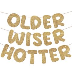 a banner that says older wiser potter hanging from a line with buntings