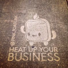 a sidewalk with an apple drawn on it and the words heat up your business written in white