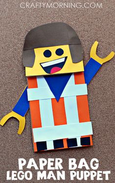 the paper bag lego man puppet is made with construction materials