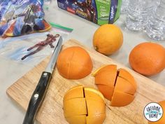 some oranges cut in half on a cutting board