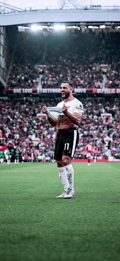 a man standing on top of a soccer field