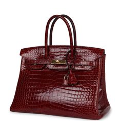 This Birkin is of Rouge H shiny Porosus Crocodile leather with gold hardware and features tonal stitching, front flap, two straps with center toggle closure, clochette with lock and two keys, and double rolled handles.The interior is lined with Rouge H chevre and has one zip pocket with an Hermes engraved zipper pull and an open pocket on the opposite side.Collection: M Square Origin: FranceCondition: Pre-owned; Excellent-The bag has some slouching on the sides and structure loss around the bottom of bag. There's partial plastic on the hardware. Visible scratches to the exposed hardware. The exterior leather shows has some minor wear with creasing and scratching to pull straps and wear around the bottom corners. The interior leather is clean with minor scuffs to interior leather base. The Birkin Bags, Hermes Birkin Handbags, Expensive Bag, Birkin Handbags, Hermes Birkin 35, Hermes Birkin 25, Luxury Purses, Handbag Heaven, Birkin 25