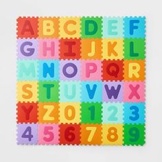 a colorful puzzle board with letters and numbers on the bottom, all in different colors