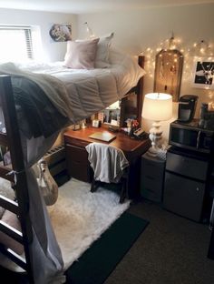 a bedroom with bunk beds and lights on the wall above it, along with other furniture