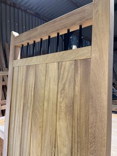 the inside of a building with wooden slats and metal bars on it's sides