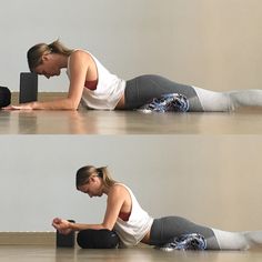 a woman is laying on the floor using her laptop