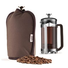 a french press coffee maker next to a bag of coffee beans on a white background