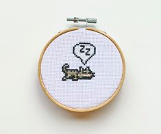 a cross stitch pattern with an image of a hot air balloon in the shape of a dog