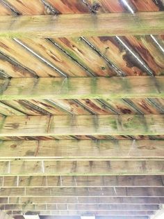 an old wooden roof with exposed wood beams