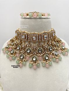 Premium quality elegant Kundan choker comes with Jhumki Earrings and Tikka/ Indian Jewelry/Premium Quality Polki and Kundan Jewelry/pink mint/pink sage green/pink pista    All items are shipped from Brampton, Ontario, Canada. If you need your item by a certain day, please reach out to us for express delivery option before placing the order so that we can update the shipping for you. Standard shipping/delivery timeline Below are the delivery timeline estimates. We dispatch all orders by the next Luxury Hand Set Traditional Choker, Luxury Hand Set Choker For Diwali, Luxury Kundan Necklace With Pallu For Eid, Luxury Pink Kundan Bridal Necklace, Luxury Pink Kundan Necklace For Festive Occasions, Luxury Pink Kundan Necklace With Meenakari, Luxury Pink Kundan Necklace For Wedding, Luxury Pink Kundan Necklaces, Luxury Pink Kundan Necklace