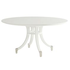 an oval white table with metal legs