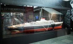 a model ship in a glass case on display