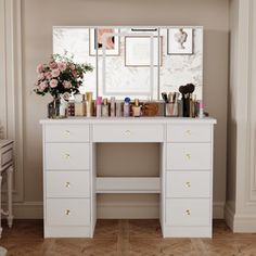 a white vanity with lots of makeup on it