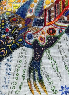 a close up of an embroidered piece of art